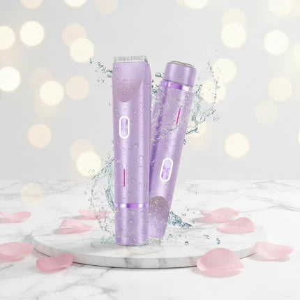 Purple hair removal device on a marble surface with pink petals and a soft light background